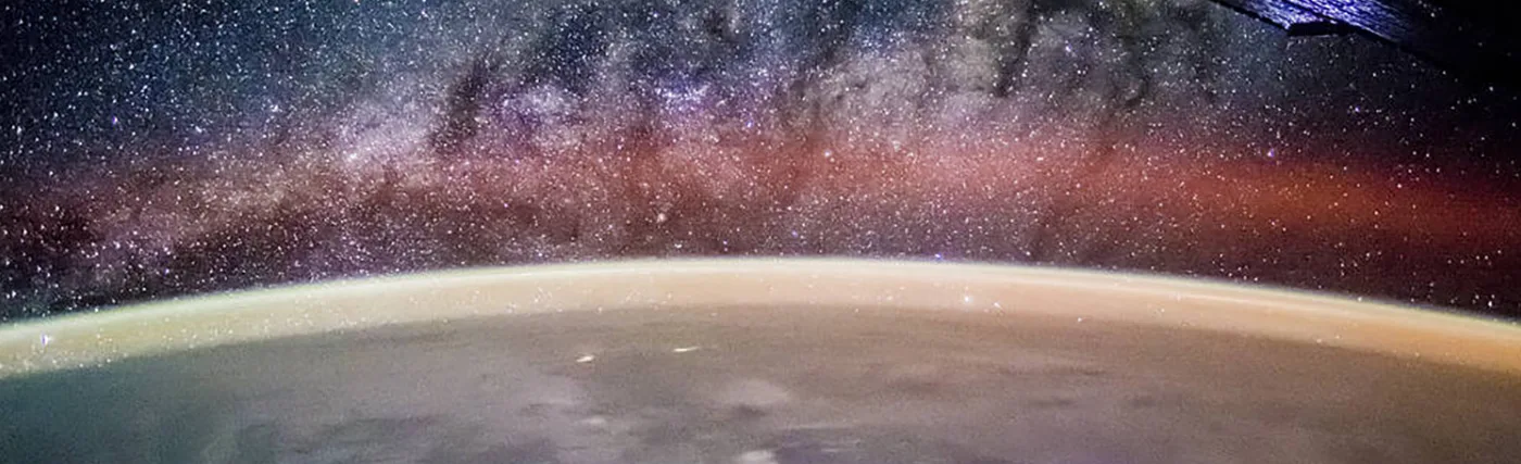 NASA’s photo from the International Space Station with a lightning storm on Earth below and the Milky Way above, taken by the Expedition 44 crew.