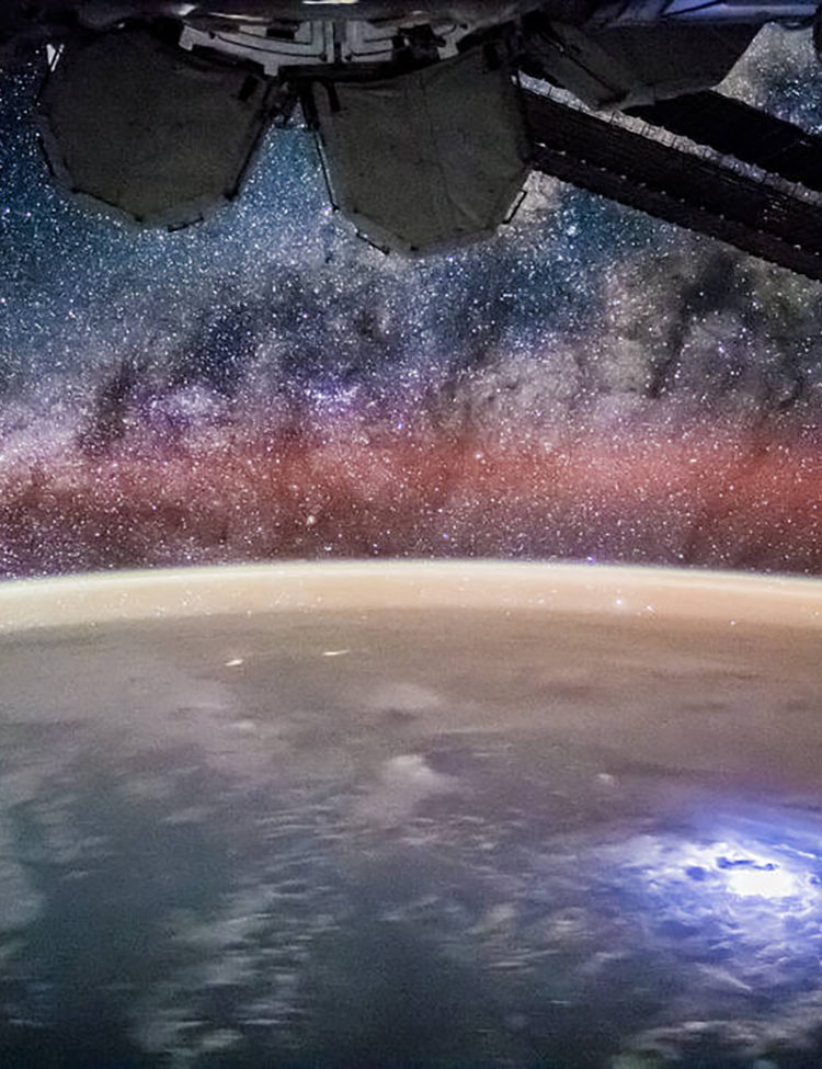 NASA’s photo from the International Space Station with a lightning storm on Earth below and the Milky Way above, taken by the Expedition 44 crew.