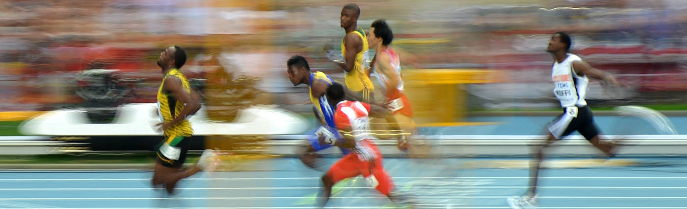Tobi 87's Image of Usain Bolt during the 100m heat of the 14th IAAF World Championships in Athletics, via Wikimedia Commons.