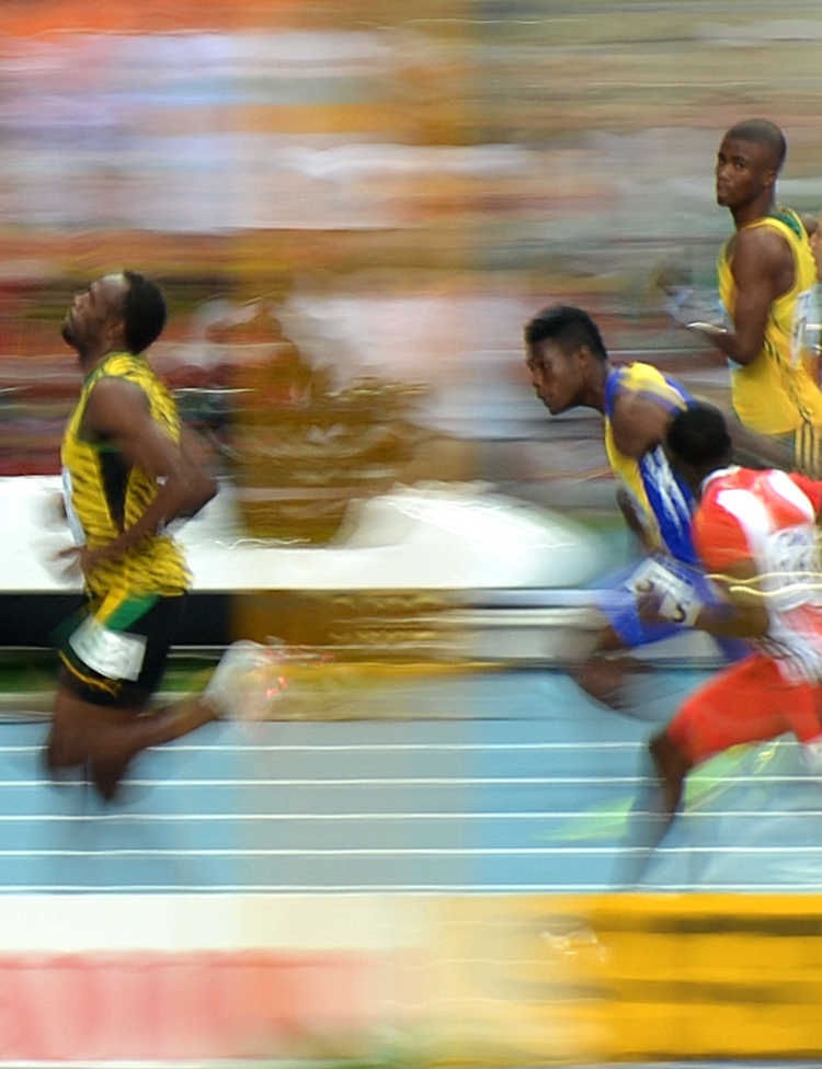Tobi 87's Image of Usain Bolt during the 100m heat of the 14th IAAF World Championships in Athletics, via Wikimedia Commons.
