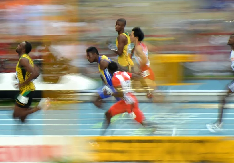 Tobi 87's Image of Usain Bolt during the 100m heat of the 14th IAAF World Championships in Athletics, via Wikimedia Commons.