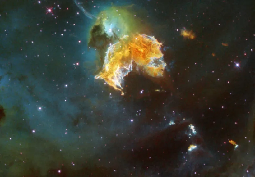 A violent and chaotic-looking mass of gas and dust is seen in this Hubble Space Telescope image of a nearby supernova remnant. Denoted N 63A, the object is the remains of a massive star that exploded, spewing its gaseous layers out into an already turbulent region.