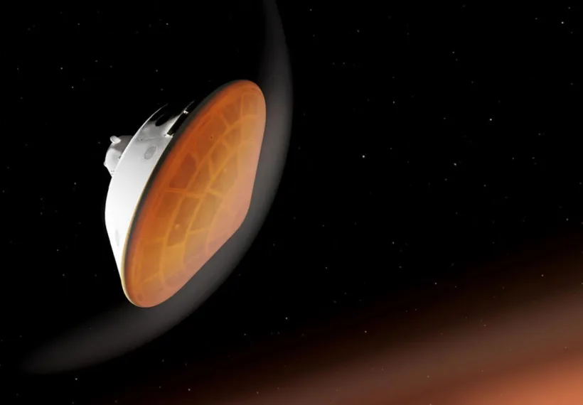 With its heat shield facing the planet, NASA’s Perseverance rover begins its descent through the Martian atmosphere in this illustration. Hundreds of critical events must execute perfectly and exactly on time for the rover to land on Mars safely on Feb. 18, 2021.