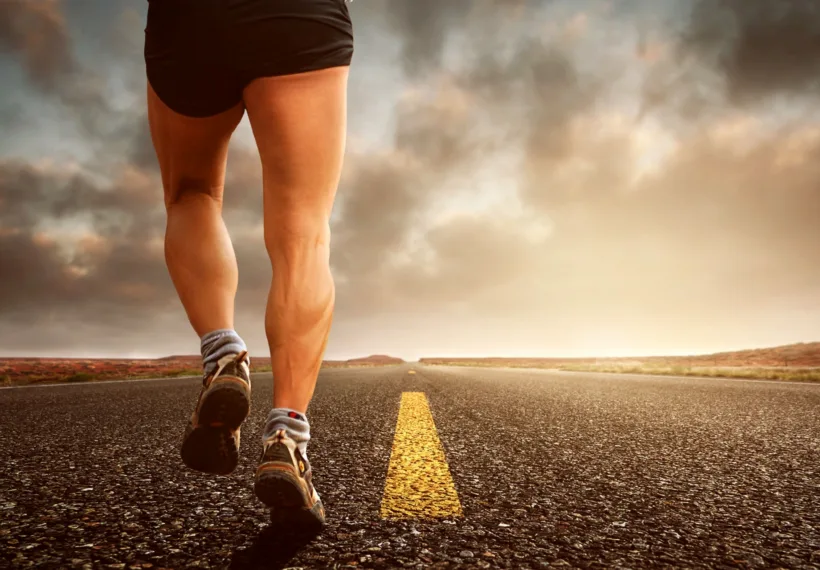 Man running on a paved road.