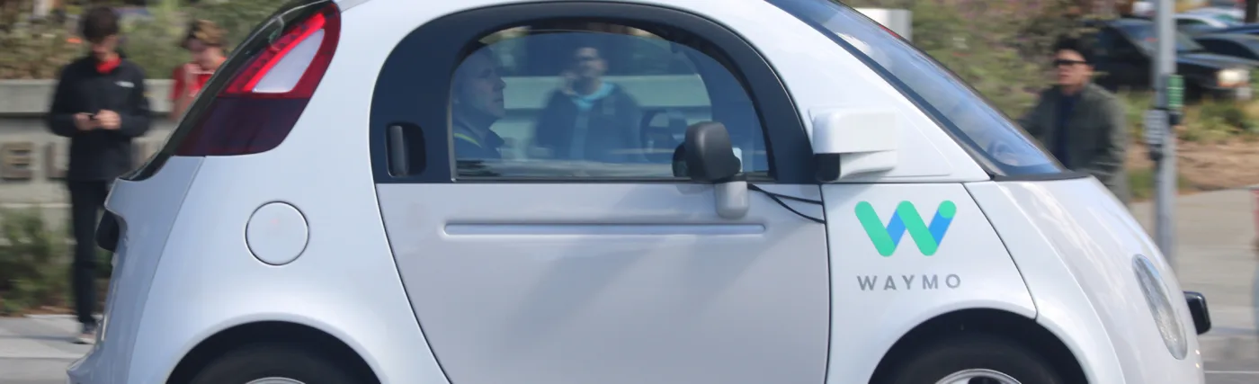Grendelkhan’s image of a Waymo self-driving car on the road in Mountain View, making a left turn. (Side view.)