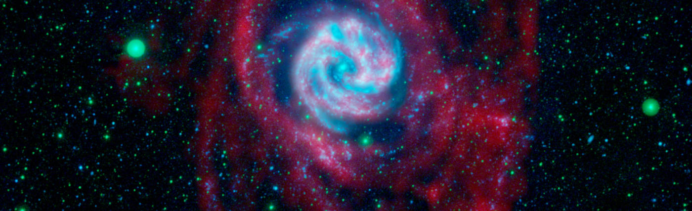 The outlying regions around the Southern Pinwheel galaxy, or M83, are highlighted in this composite image from NASA's Galaxy Evolution Explorer and the National Science Foundation's Very Large Array in New Mexico. The blue and pink pinwheel in the center is the galaxy's main stellar disk, while the flapping, ribbon-like structures are its extended arms.