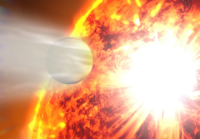 This artist's rendering illustrates the evaporation of HD 189733b's atmosphere in response to a powerful eruption from its host star.