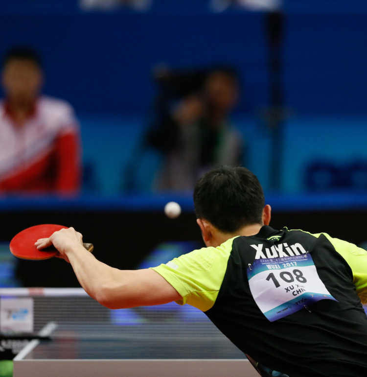 XIAOYU TANG’s photo of a table tennis player hitting a ball.