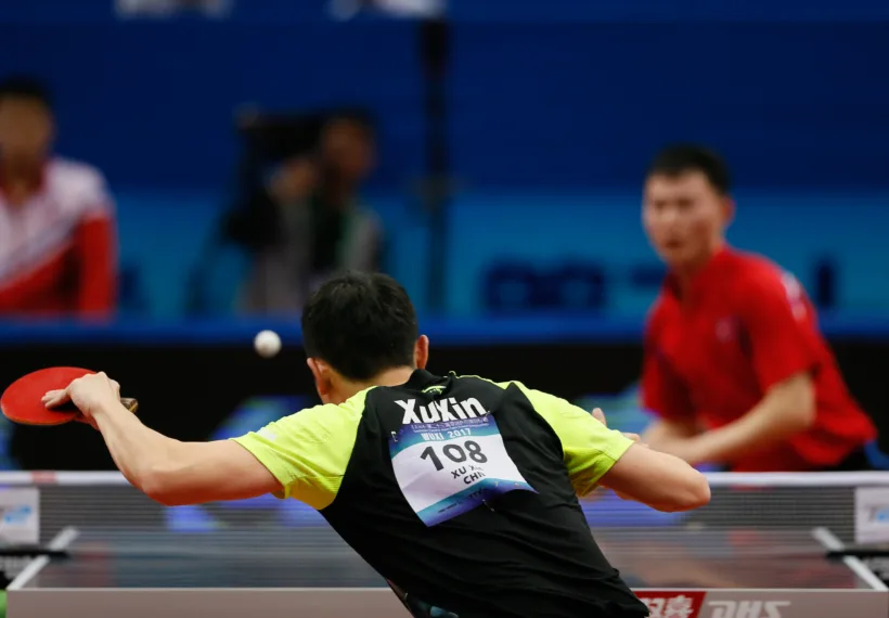 XIAOYU TANG’s photo of a table tennis player hitting a ball.