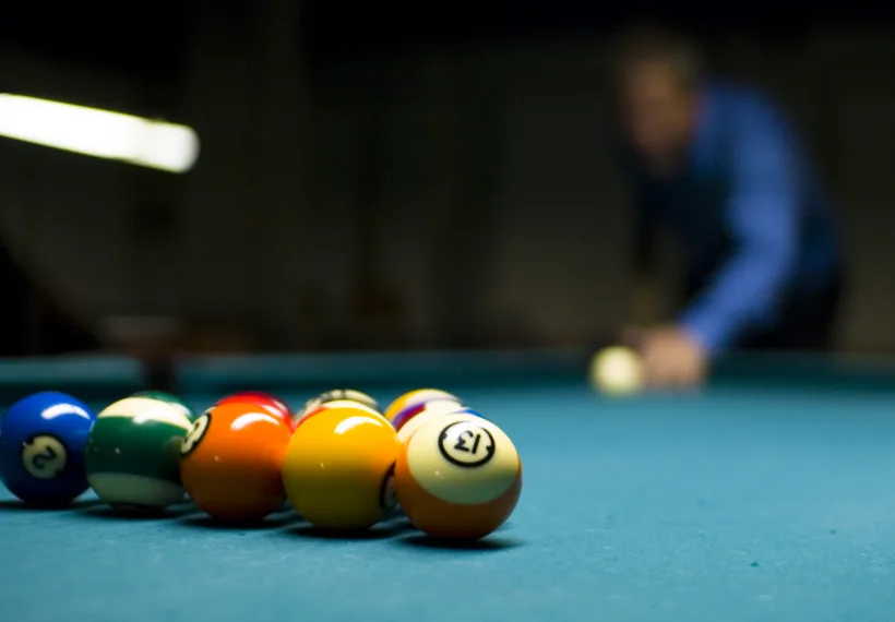 An eight ball rack about to be broken