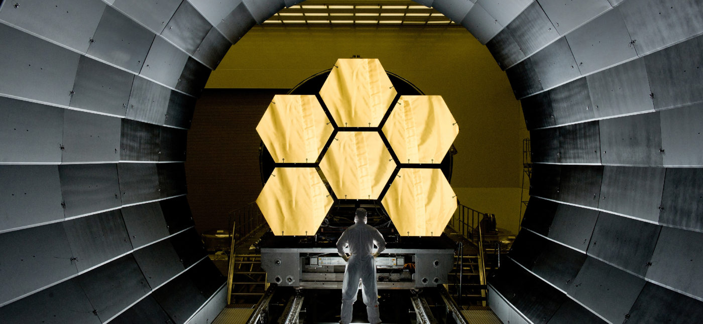 NASA engineer Ernie Wright looks on as the first six flight ready James Webb Space Telescope's primary mirror segments are prepped to begin final cryogenic testing at NASA's Marshall Space Flight Center.