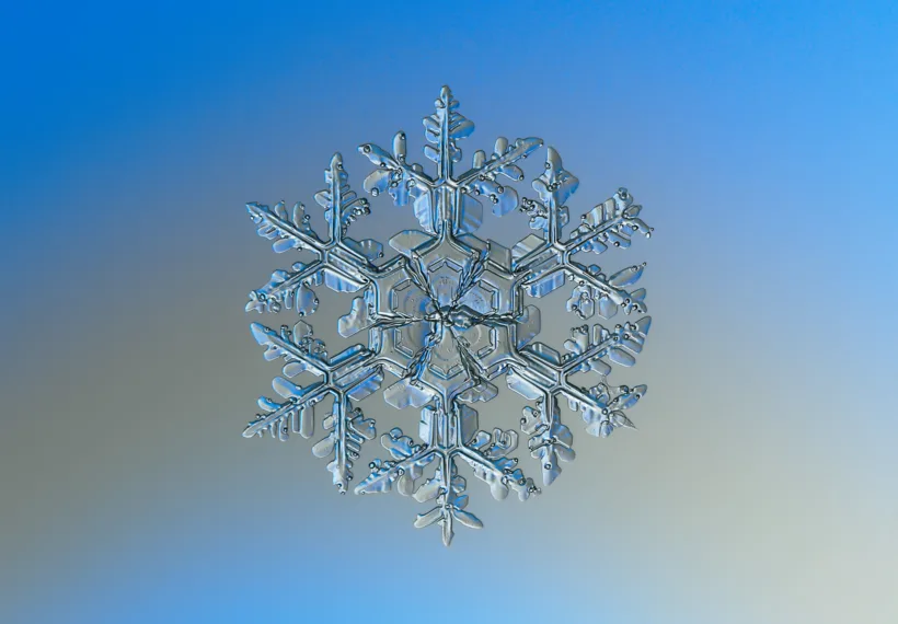 Macro photography of natural snowflake. This is relatively big crystal, 4 or 5 millimeters in diameter. Glass background with backlight, additional lens Helios 44M-5, december 2014, Moscow. 11 RAWs averaged.