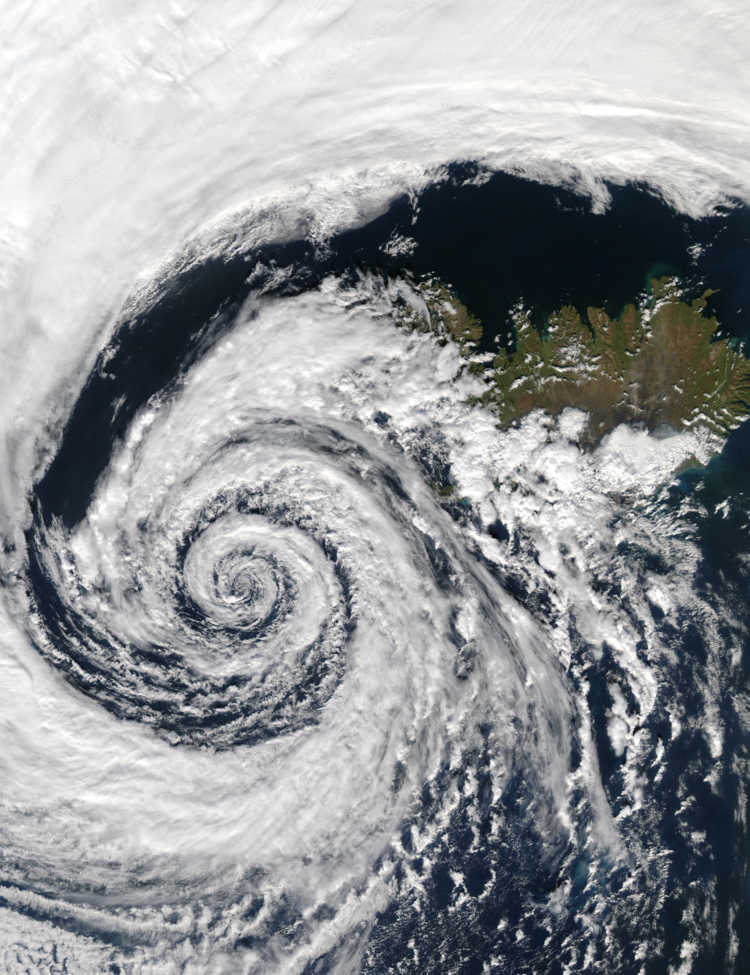 A beautifully-formed low-pressure system swirls off the southwestern coast of Iceland, illustrating the maxim that "nature abhors a vacuum." The image was taken by the Aqua MODIS instrument on September 4, 2003.