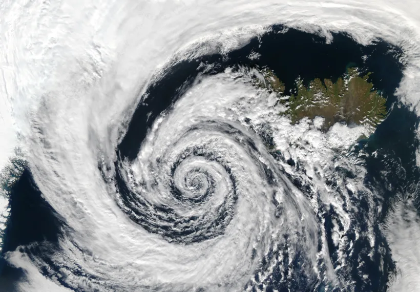 A beautifully-formed low-pressure system swirls off the southwestern coast of Iceland, illustrating the maxim that "nature abhors a vacuum." The image was taken by the Aqua MODIS instrument on September 4, 2003.