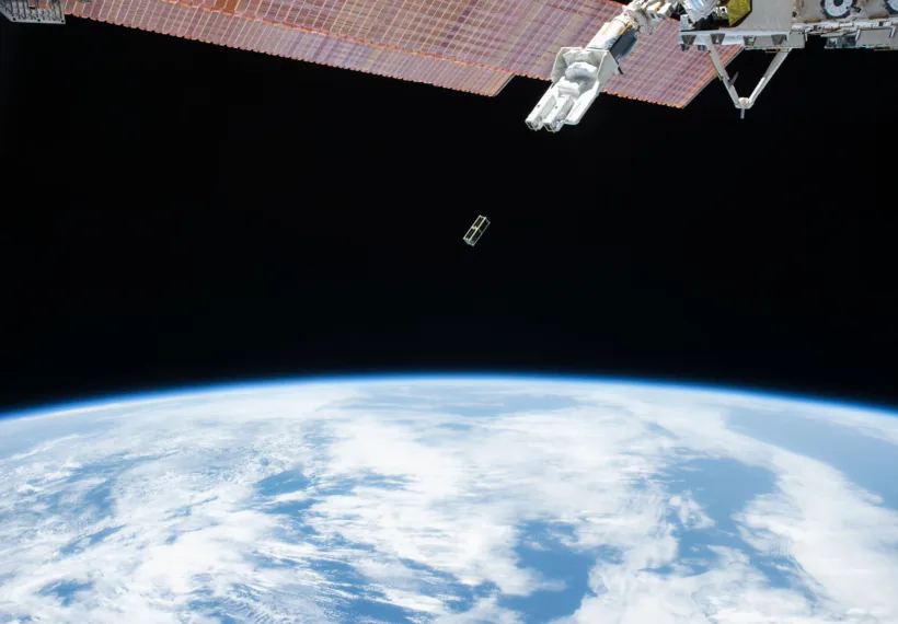 A Japanese Small Satellite is deployed from outside the Japanese Experiment Module on Sept. 17, 2015. Two satellites were sent into Earth orbit by the Small Satellite Orbital Deployer.