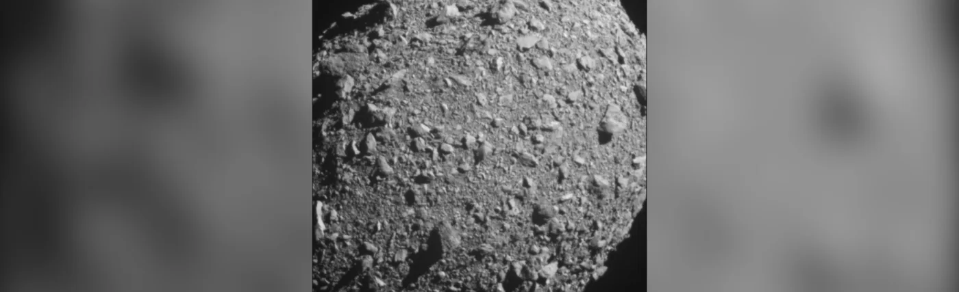 Asteroid moonlet Dimorphos as seen by the DART spacecraft about 3 seconds before impact. DART's on board DRACO imager captured this image. Dimorphos is roughly 525 feet (160 meters) in length.