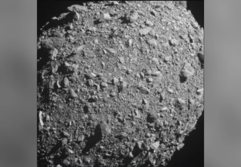 Asteroid moonlet Dimorphos as seen by the DART spacecraft about 3 seconds before impact. DART's on board DRACO imager captured this image. Dimorphos is roughly 525 feet (160 meters) in length.
