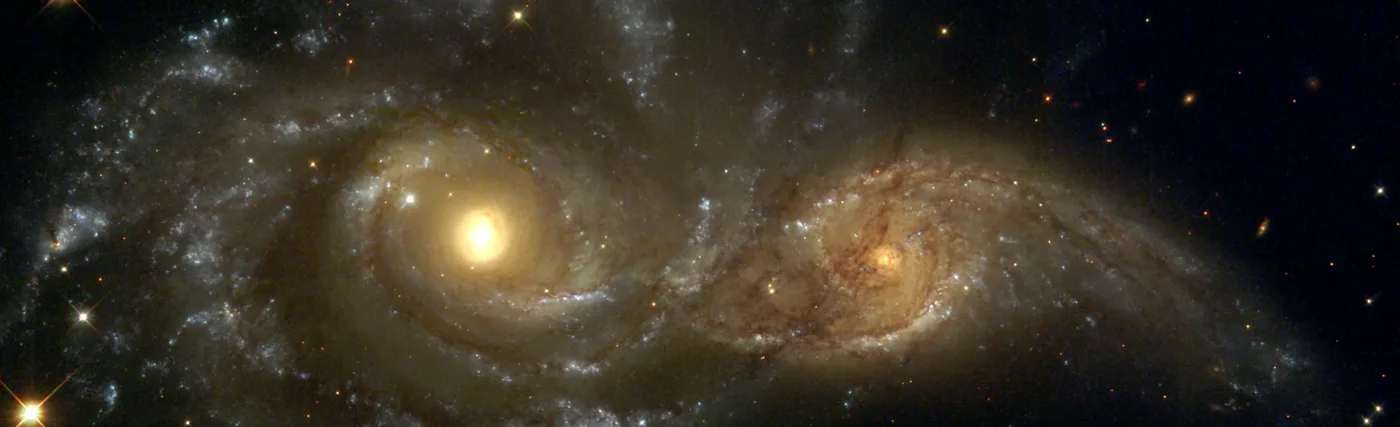 Near colliding NGC 2207 and IC 2163 as seen by the NASA/ESA Hubble Space Telescope.