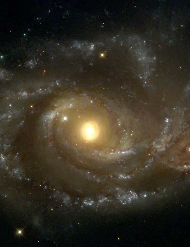Near colliding NGC 2207 and IC 2163 as seen by the NASA/ESA Hubble Space Telescope.