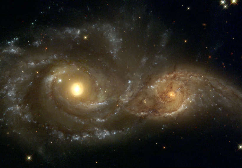 Near colliding NGC 2207 and IC 2163 as seen by the NASA/ESA Hubble Space Telescope.