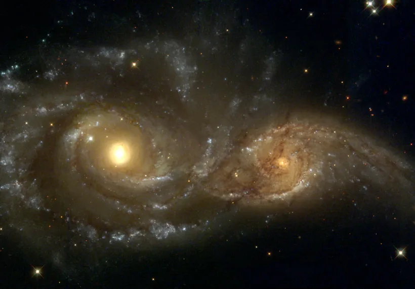 Near colliding NGC 2207 and IC 2163 as seen by the NASA/ESA Hubble Space Telescope.