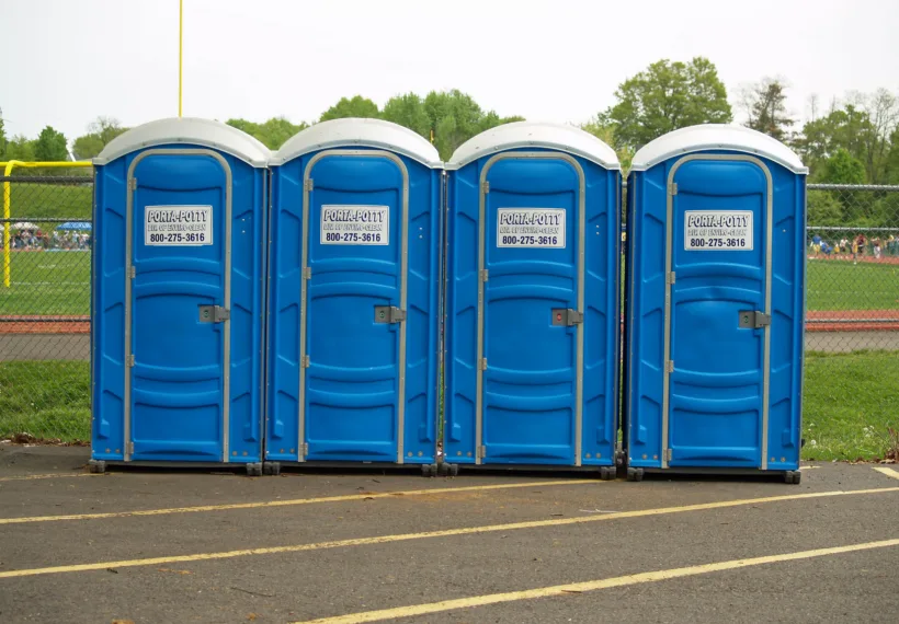 A row of four Porta Potties by David Shankbone