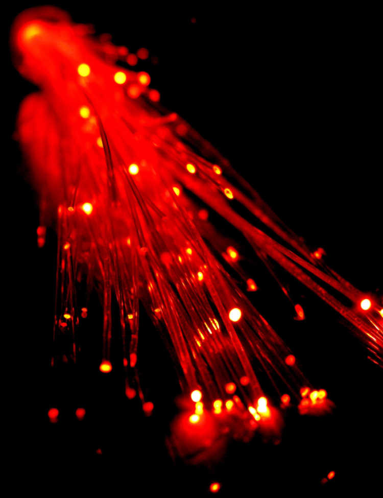 Glowing red optical fibers.
