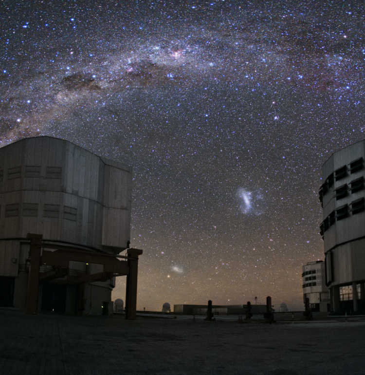 Taken by ESO photo ambassador Yuri Beletsky, two of the Very Large Telescope's Unit Telescopes quietly bask in the starlight, observing the Milky Way as it arches over ESO's Paranal Observatory atop Cerro Paranal high above the Atacama Desert in Chile.