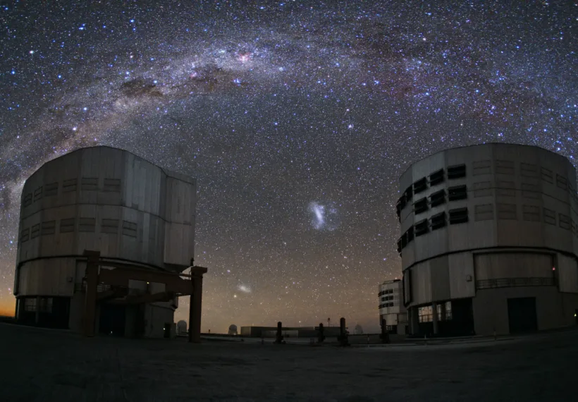 Taken by ESO photo ambassador Yuri Beletsky, two of the Very Large Telescope's Unit Telescopes quietly bask in the starlight, observing the Milky Way as it arches over ESO's Paranal Observatory atop Cerro Paranal high above the Atacama Desert in Chile.