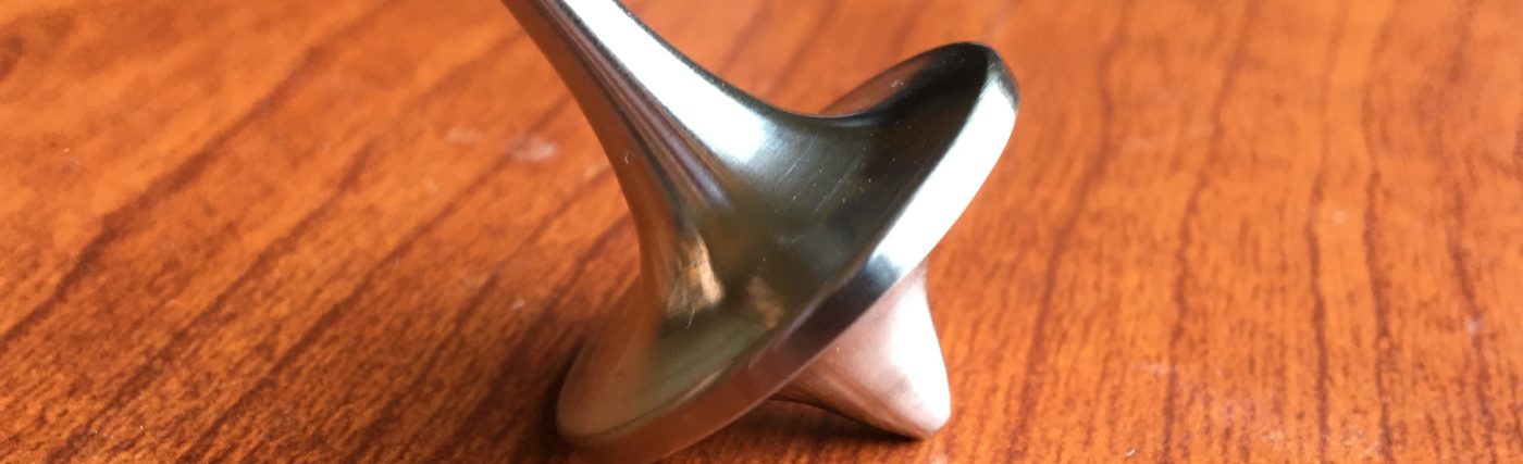 A spinning top made out of Humanium, marketed by Foreverspin.