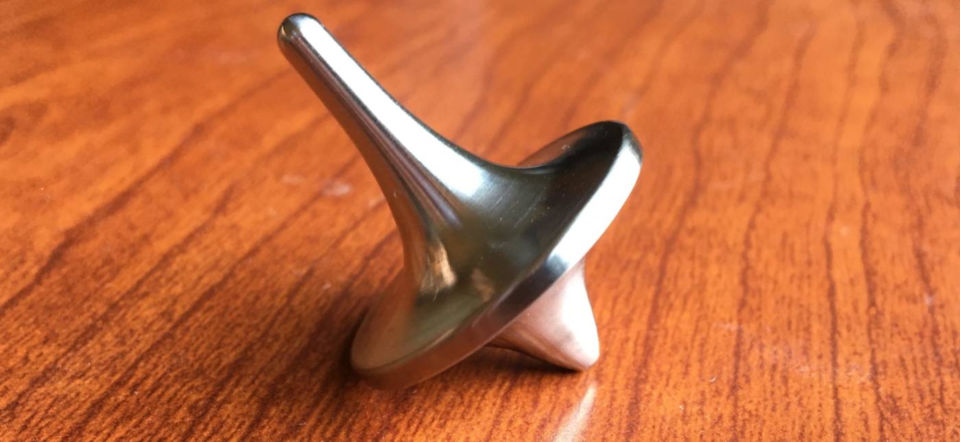 A spinning top made out of Humanium, marketed by Foreverspin.