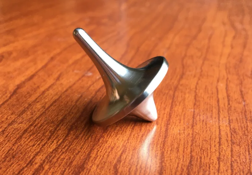 A spinning top made out of Humanium, marketed by Foreverspin.