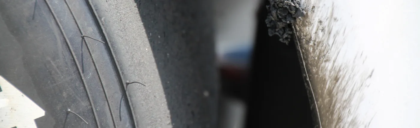 Detail on a tire and car (Helio Castroneves) after the 99th running of the Indianapolis 500