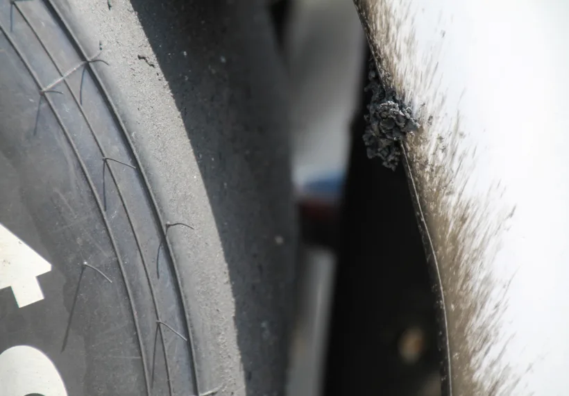 Detail on a tire and car (Helio Castroneves) after the 99th running of the Indianapolis 500