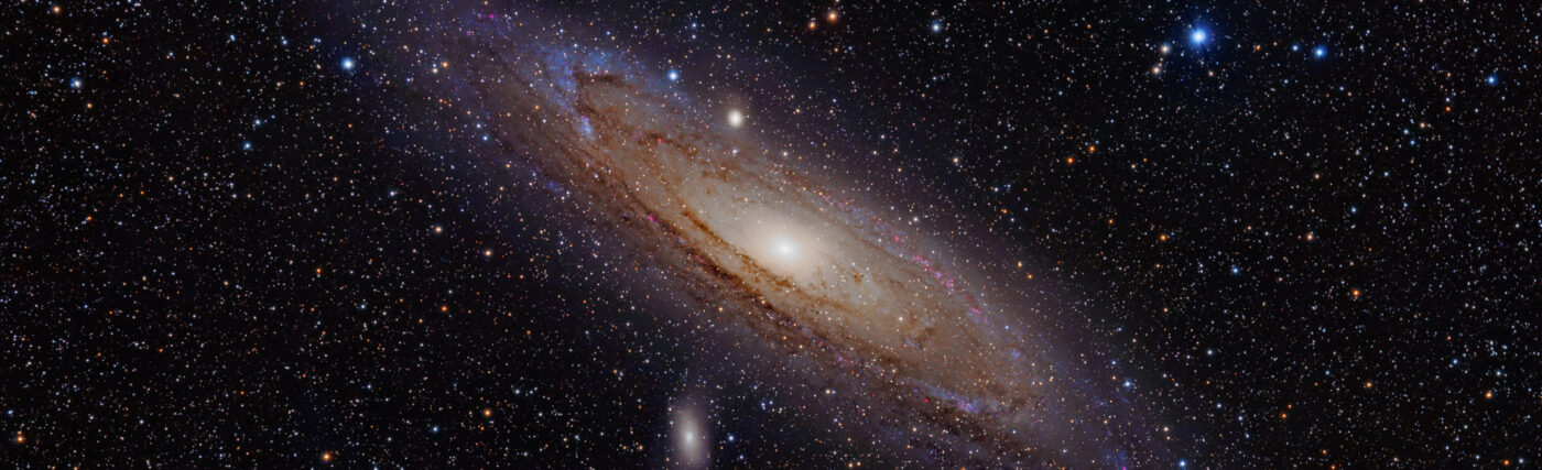 The Andromeda Galaxy is a spiral galaxy approximately 2.5 million light-years away in the constellation Andromeda. The image also shows Messier Objects 32 and 110, as well as NGC 206 (a bright star cloud in the Andromeda Galaxy) and the star Nu Andromedae. This image was taken using a hydrogen-alpha filter.