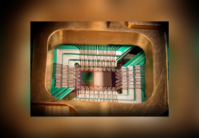 Photograph of a chip constructed by D-Wave Systems Inc. designed to operate as a 128-qubit superconducting adiabatic quantum optimization processor, mounted in a sample holder.