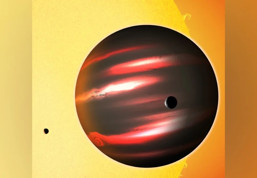 The distant exoplanet TrES-2b, shown here in an artist's conception, is darker than the blackest coal. This Jupiter-sized world reflects less than one percent of the light that falls on it, making it blacker than any planet or moon in our solar system. Astronomers aren't sure what vapours in the planet's superheated atmosphere cloak it so effectively.