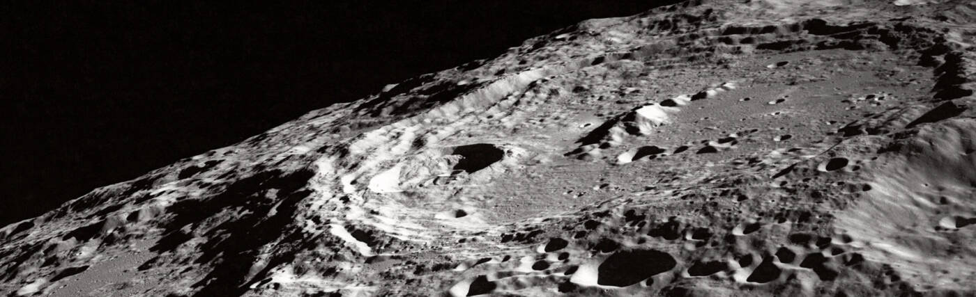 This oblique view featuring International Astronomical Union (IAU) Crater 302 on the Moon surface was photographed by the Apollo 10 astronauts in May of 1969. Note the terraced walls of the crater and central cone. Center point coordinates are located at 162 degrees, 2 minutes east longitude and 10 degrees, 1 minute south latitude. One of the Apollo 10 astronauts aimed a handheld 70mm camera at the surface from lunar orbit for a series of pictures in this area. The large crater at right is Keeler (used to be called 302), and to its left is Heaviside. This is on the far side, not on the limb as viewed from Earth. The official designation of this photo is AS10-32-4823.