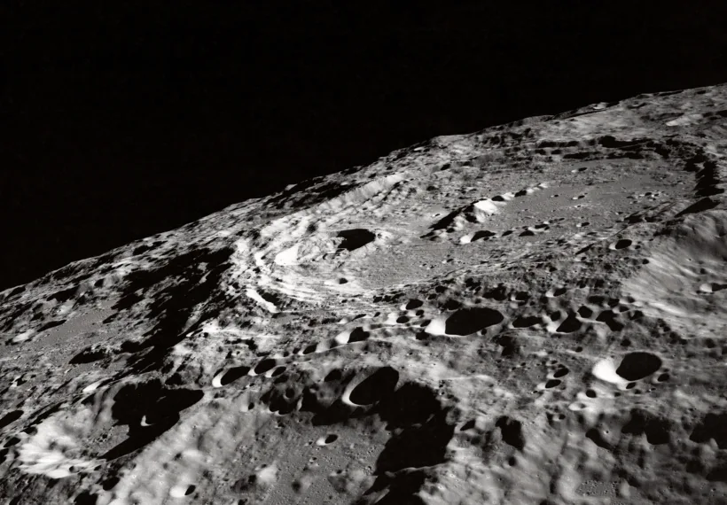 This oblique view featuring International Astronomical Union (IAU) Crater 302 on the Moon surface was photographed by the Apollo 10 astronauts in May of 1969. Note the terraced walls of the crater and central cone. Center point coordinates are located at 162 degrees, 2 minutes east longitude and 10 degrees, 1 minute south latitude. One of the Apollo 10 astronauts aimed a handheld 70mm camera at the surface from lunar orbit for a series of pictures in this area. The large crater at right is Keeler (used to be called 302), and to its left is Heaviside. This is on the far side, not on the limb as viewed from Earth. The official designation of this photo is AS10-32-4823.