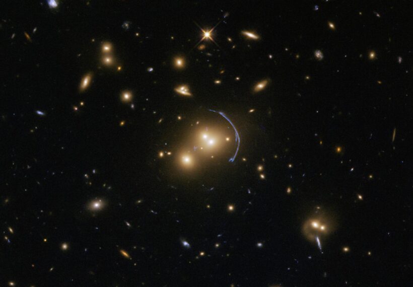 This Hubble Space Telescope image demonstrates the immense effects of gravity; more specifically, it shows the effects of gravitational lensing caused by a cluster of galaxies called SDSS J1152+3313. Gravitational lenses possess immense masses that warp their surroundings and bend the light from faraway objects into rings, arcs, streaks, blurs, and other odd shapes.