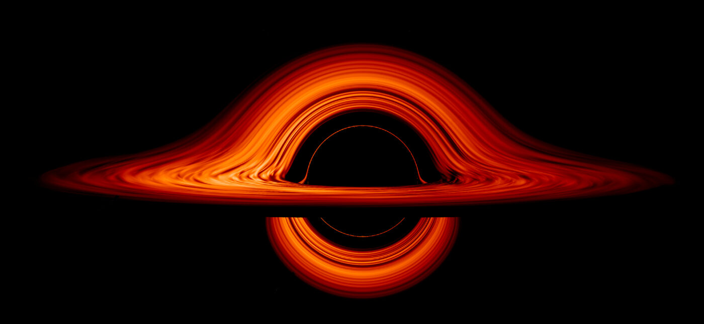 Seen nearly edgewise, the turbulent disk of gas churning around a black hole takes on a crazy double-humped appearance. The black hole’s extreme gravity alters the paths of light coming from different parts of the disk, producing the warped image.