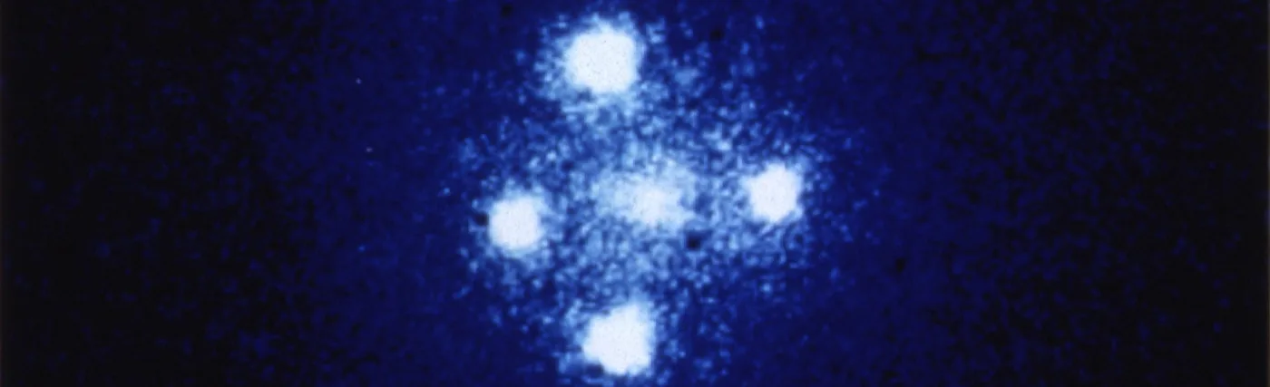The European Space Agency's Faint Object Camera on board NASA's Hubble Space Telescope has provided astronomers with the most detailed image ever taken of the gravitational lens G2237 + 0305 — sometimes referred to as the Einstein Cross. The photograph shows four images of a very distant quasar which has been multiple-imaged by a relatively nearby galaxy acting as a gravitational lens. The angular separation between the upper and lower images is 1.6 arcseconds.