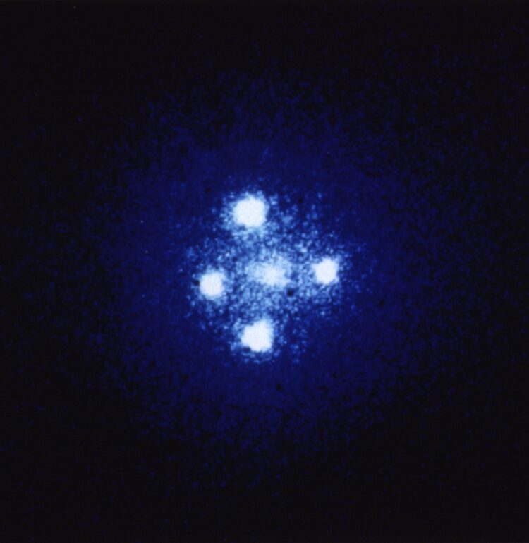 The European Space Agency's Faint Object Camera on board NASA's Hubble Space Telescope has provided astronomers with the most detailed image ever taken of the gravitational lens G2237 + 0305 — sometimes referred to as the Einstein Cross. The photograph shows four images of a very distant quasar which has been multiple-imaged by a relatively nearby galaxy acting as a gravitational lens. The angular separation between the upper and lower images is 1.6 arcseconds.