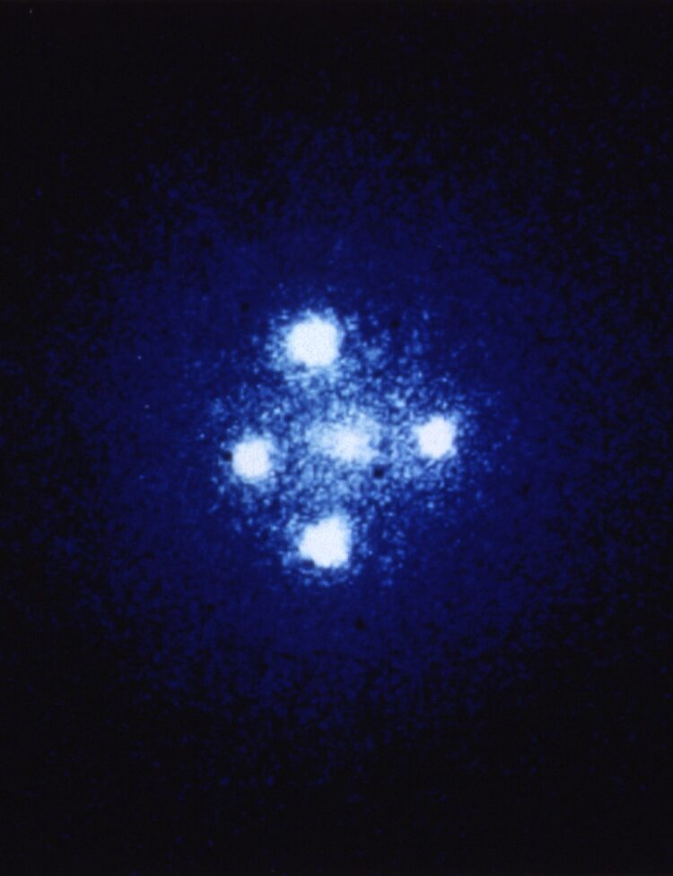 The European Space Agency's Faint Object Camera on board NASA's Hubble Space Telescope has provided astronomers with the most detailed image ever taken of the gravitational lens G2237 + 0305 — sometimes referred to as the Einstein Cross. The photograph shows four images of a very distant quasar which has been multiple-imaged by a relatively nearby galaxy acting as a gravitational lens. The angular separation between the upper and lower images is 1.6 arcseconds.