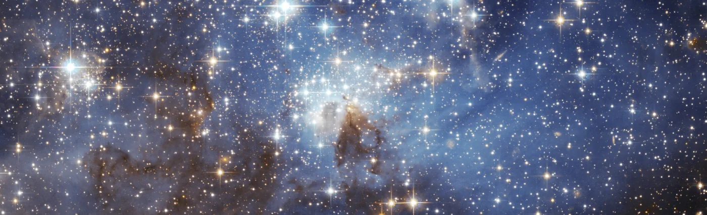 The image is from the European Space Agency. It is listed as the LH 95 star forming region of the Large Magellanic Cloud. The image was taken using the Hubble Space Telescope.