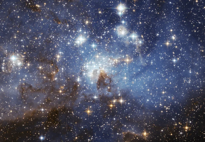 The image is from the European Space Agency. It is listed as the LH 95 star forming region of the Large Magellanic Cloud. The image was taken using the Hubble Space Telescope.