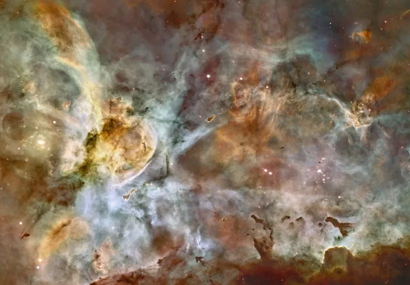 A composite image of NGC 3372 based on data from Hubble Space Telescope (HST) and NOIRLab. The image is a composite of 48 frames and depicts an area 50 light-years wide. The false color image was created using the following formula: red for sulfur, green for hydrogen, and blue for oxygen emissions.