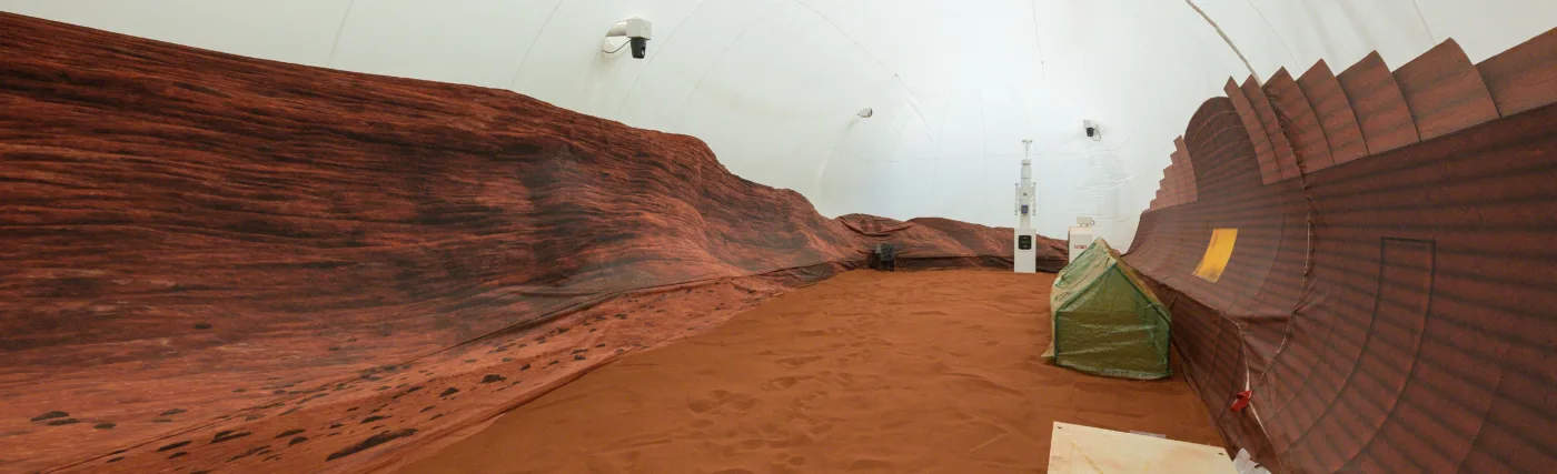 NASA’s simulated Mars habitat includes a 1,200-square-foot sandbox with red sand to simulate the Martian landscape. The area will be used to conduct simulated spacewalks or “Marswalks” during the analog missions. PHOTO DATE: 11-30-22 LOCATION: Bldg. 220 - CHAPEA SUBJECT: Photography of Crew Health and Performance Exploration Analog (CHAPEA) facility PHOTOGRAPHER: BILL STAFFORD