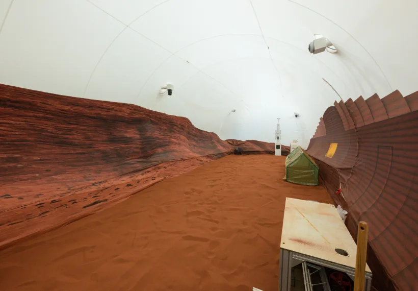 NASA’s simulated Mars habitat includes a 1,200-square-foot sandbox with red sand to simulate the Martian landscape. The area will be used to conduct simulated spacewalks or “Marswalks” during the analog missions. PHOTO DATE: 11-30-22 LOCATION: Bldg. 220 - CHAPEA SUBJECT: Photography of Crew Health and Performance Exploration Analog (CHAPEA) facility PHOTOGRAPHER: BILL STAFFORD