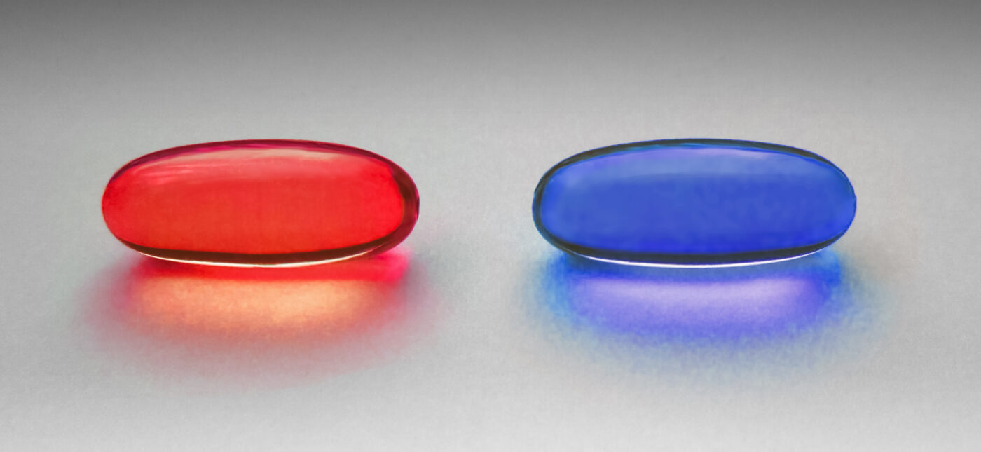 Red and blue pill as in the Matrix. The original photo is of two yellow omega-3 capsules, placed on a grainy paper on a windowsill. Light all natural from the window. Processed in Photoshop for color. Photographed in Visby, Gotland, Sweden.